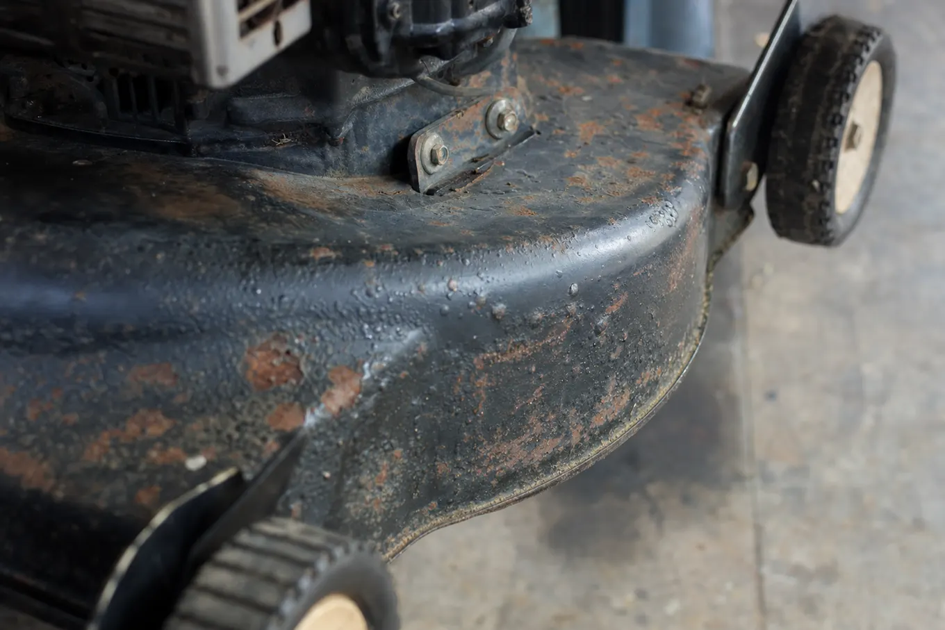 Rust forming along the seams of a lawn mower deck exposed to salt air near Charlotte Harbor